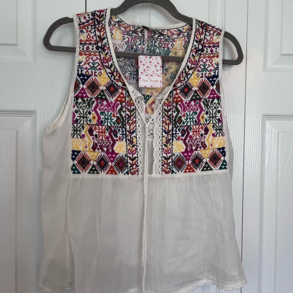 Free People top, ivory gauze with multi colored embroidery. Size large